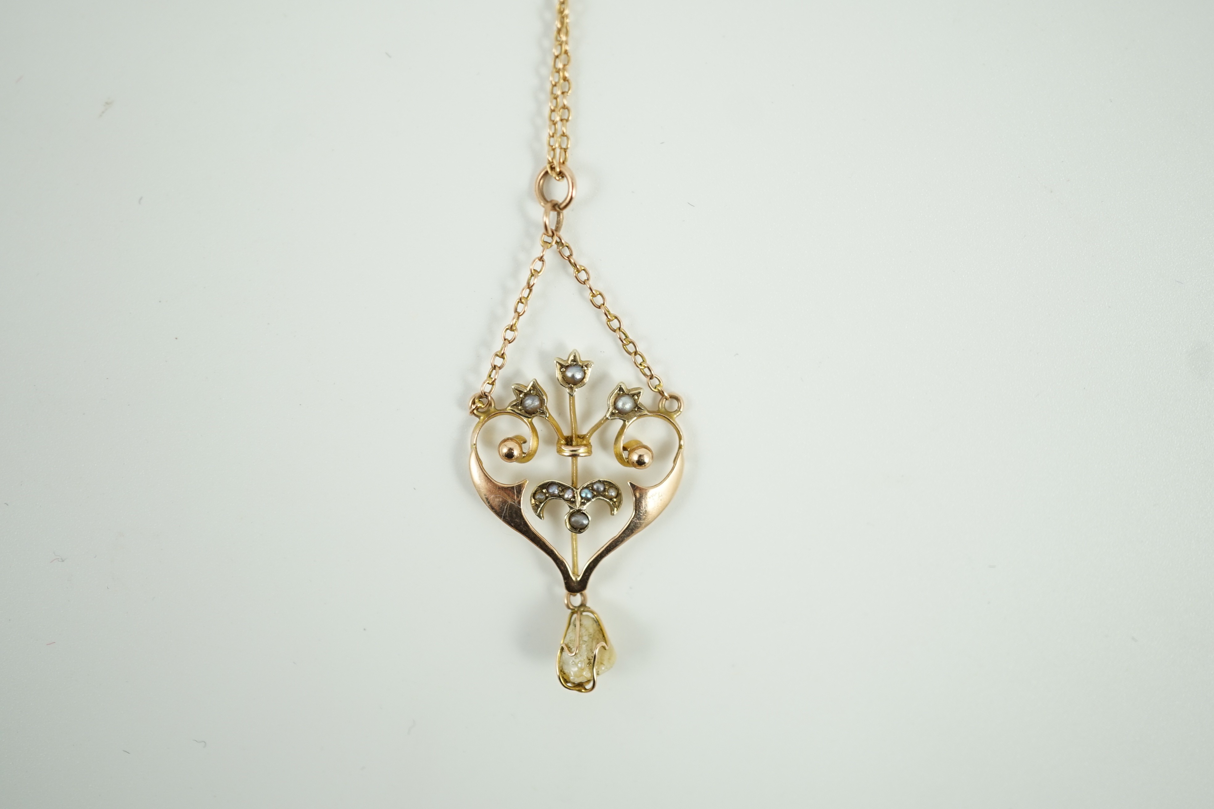 An Edwardian 9ct, baroque and seed pearl set drop pendant necklace, 47cm, gross weight 4.3 grams.